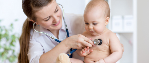 pediatrician examining the baby with stethoscope